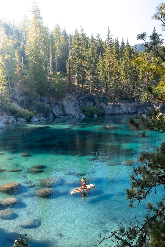 Girl paddle boarding at Secret Cove Lake Tahoe