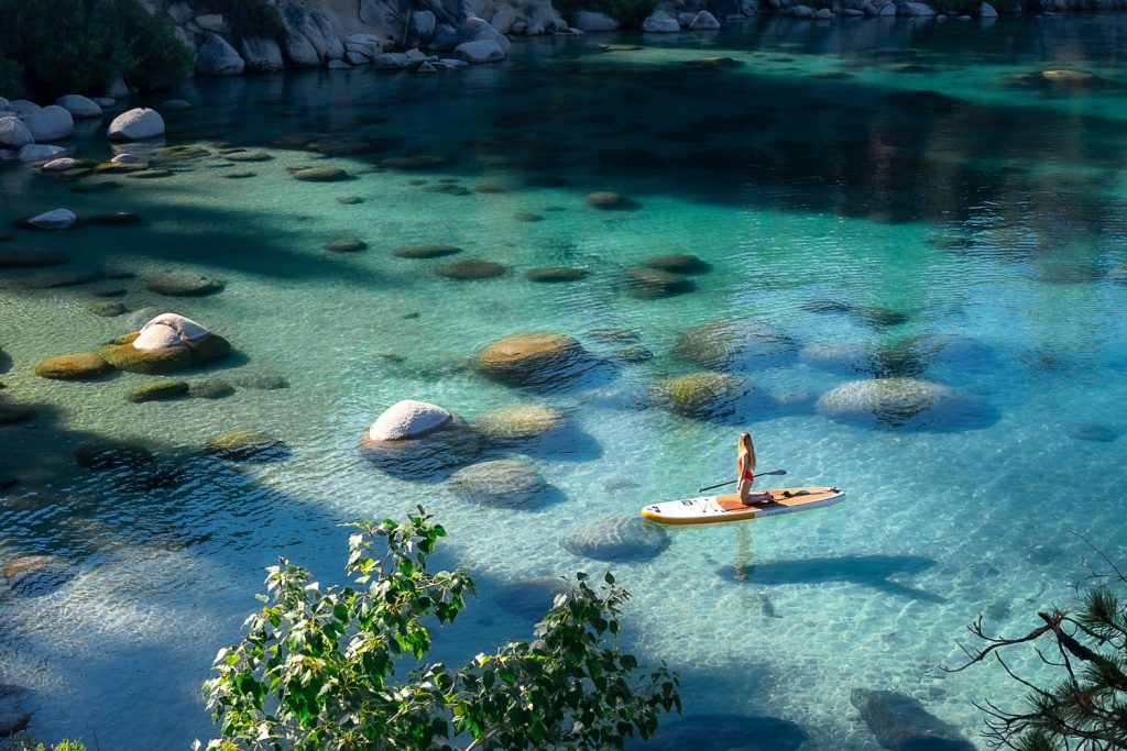 Girl Paddle boarding on Lake Tahoe